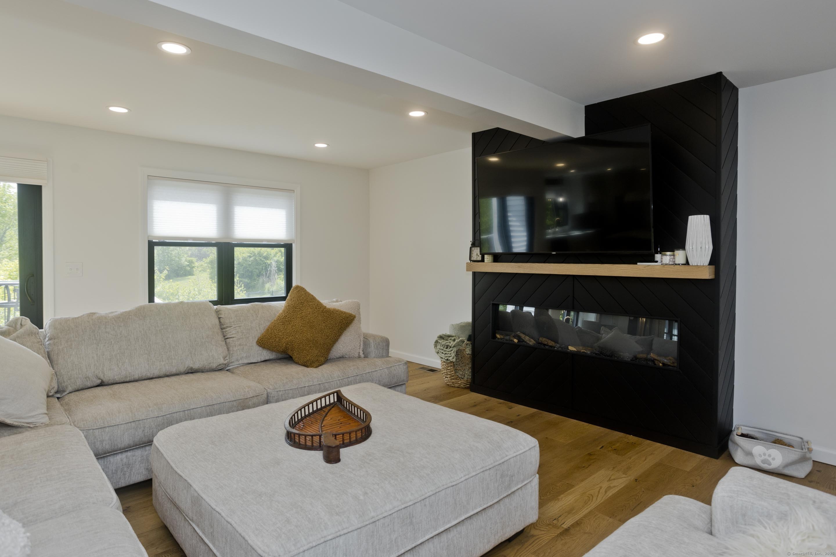 56 Margaret Street Monson, MA 01057 - Photo 17 of 39 a living room with furniture and a fireplace