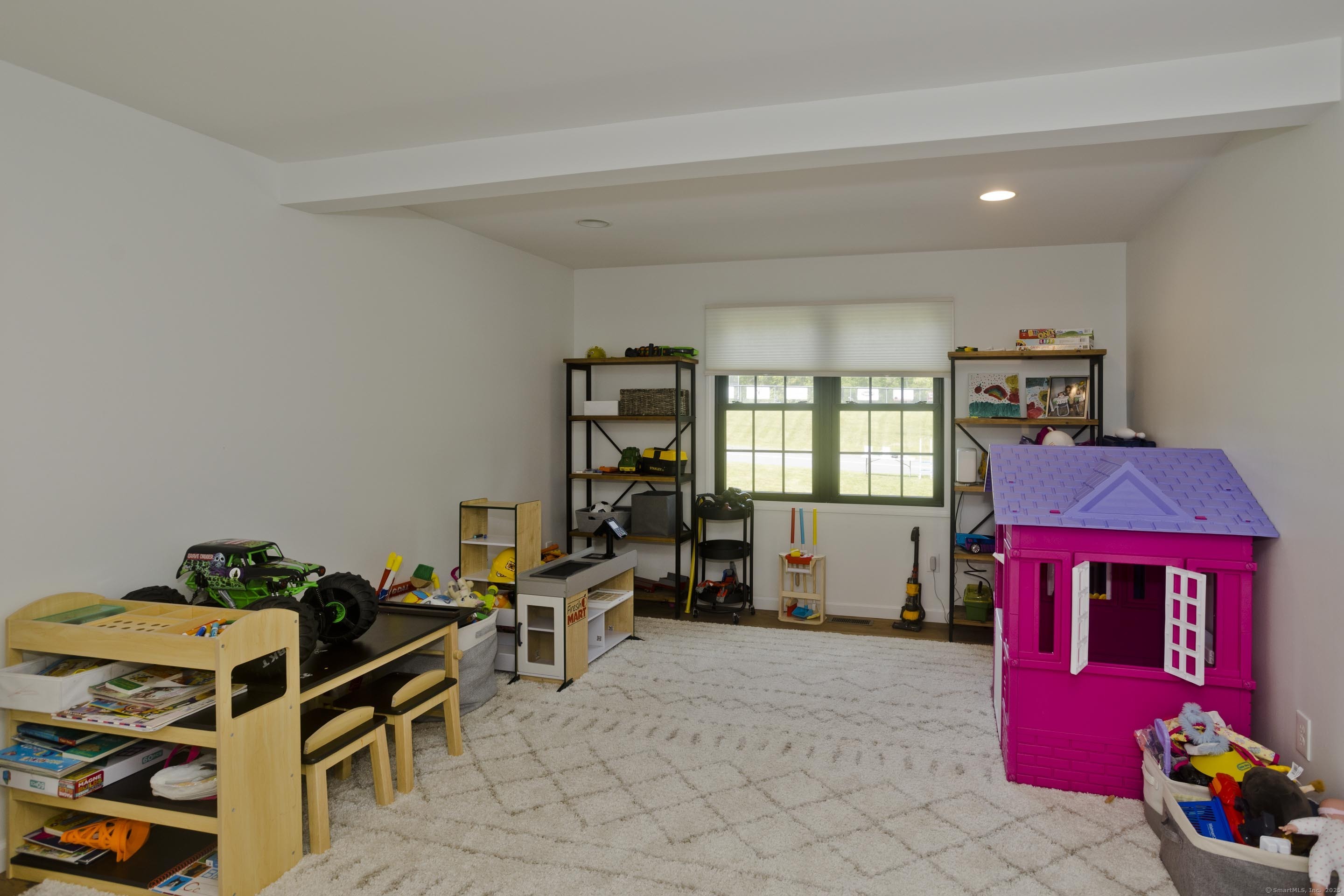 56 Margaret Street Monson, MA 01057 - Photo 18 of 39 a living room with furniture gym equipment and a window