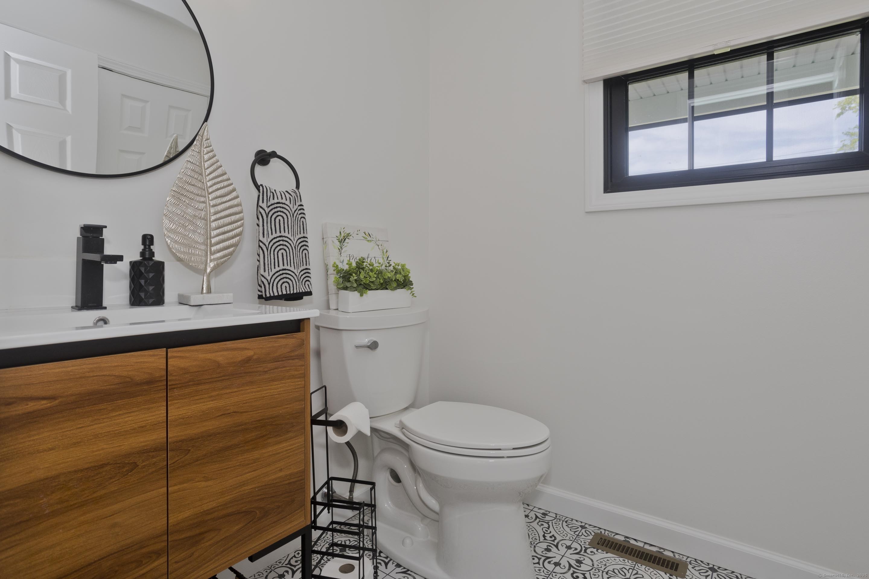 56 Margaret Street Monson, MA 01057 - Photo 19 of 39 a bathroom with a toilet a sink and a mirror