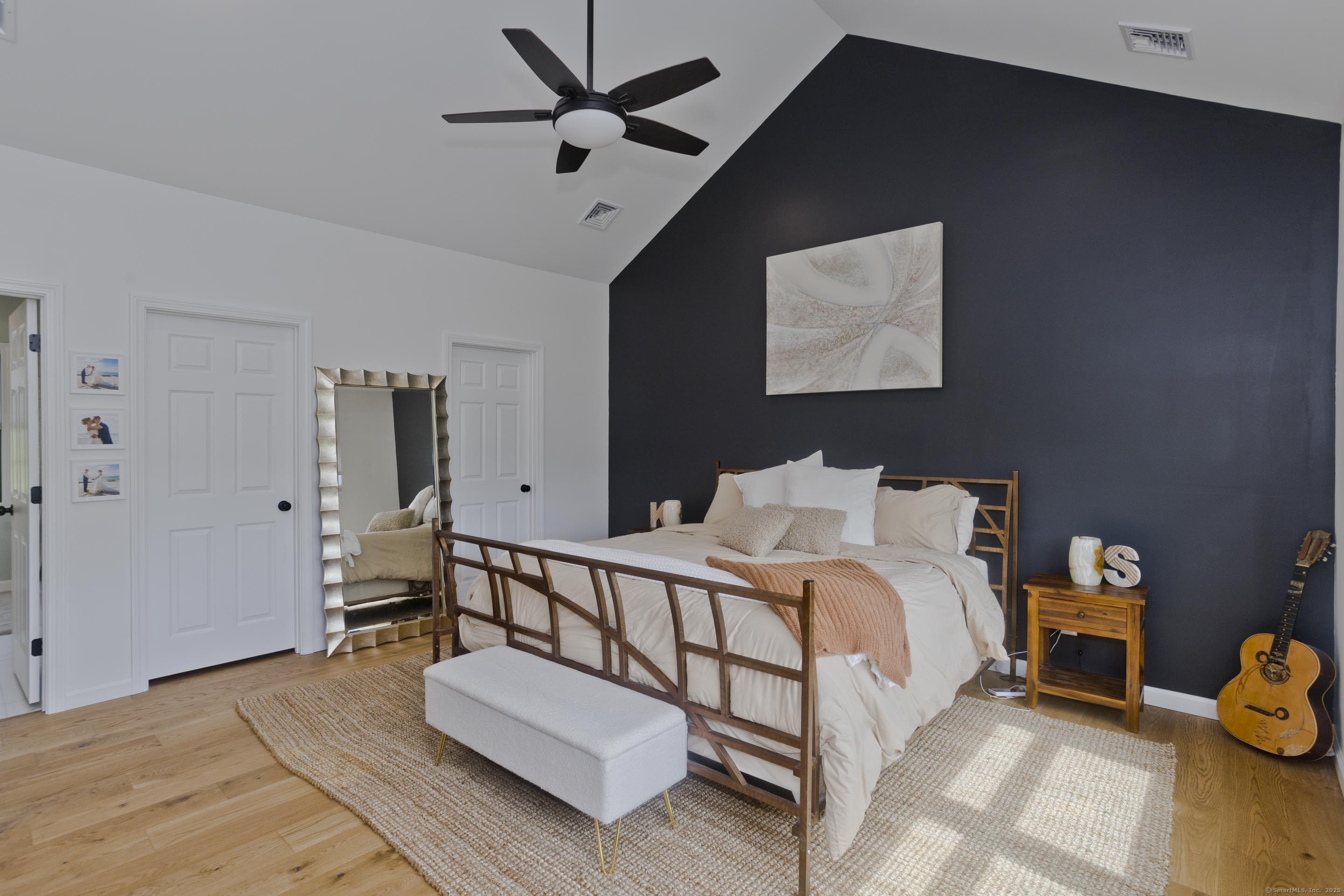 56 Margaret Street Monson, MA 01057 - Photo 20 of 39 a bed room with a bed and a ceiling fan