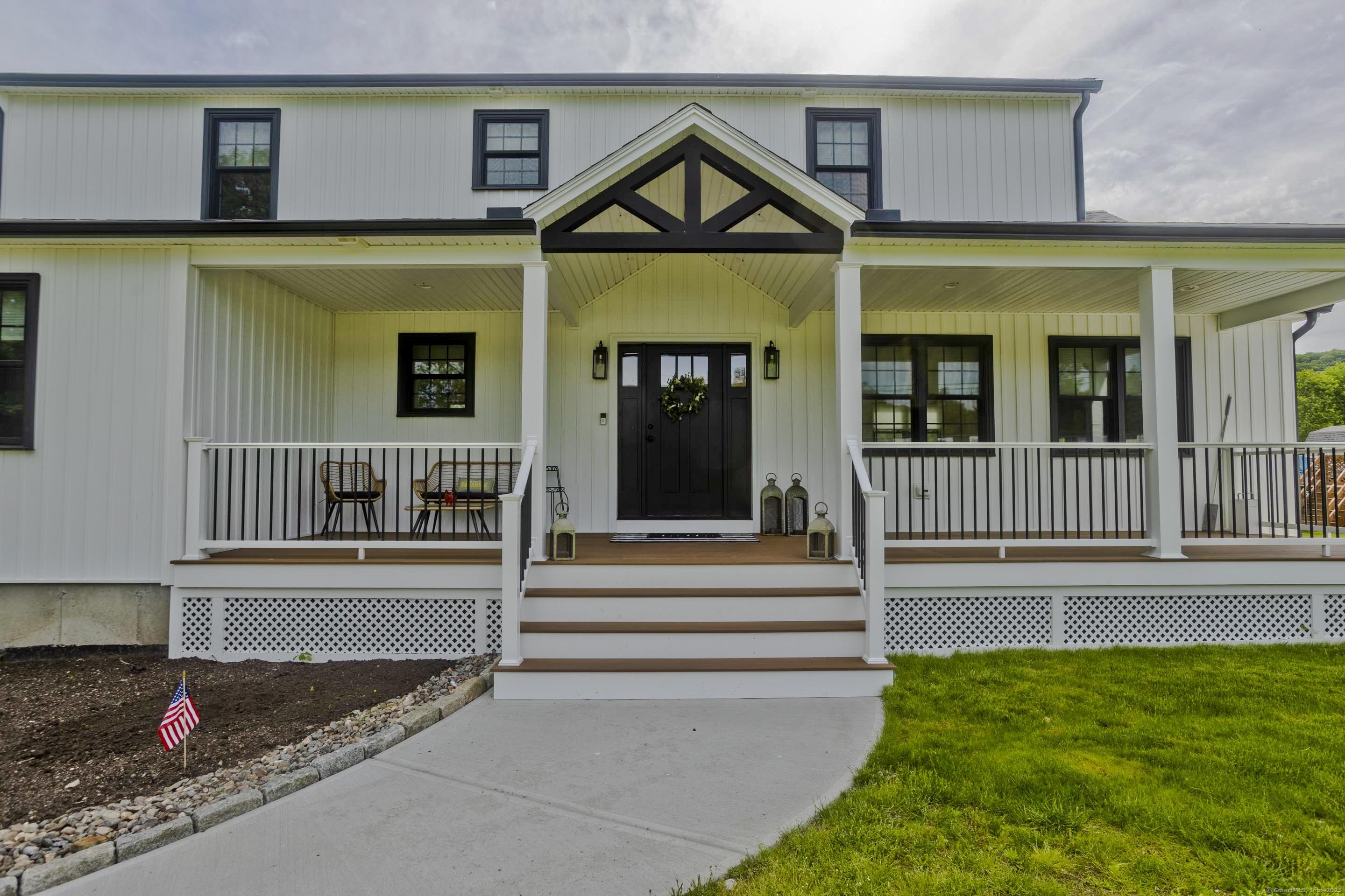 56 Margaret Street Monson, MA 01057 - Photo 2 of 39 a front view of a house with a yard and fence