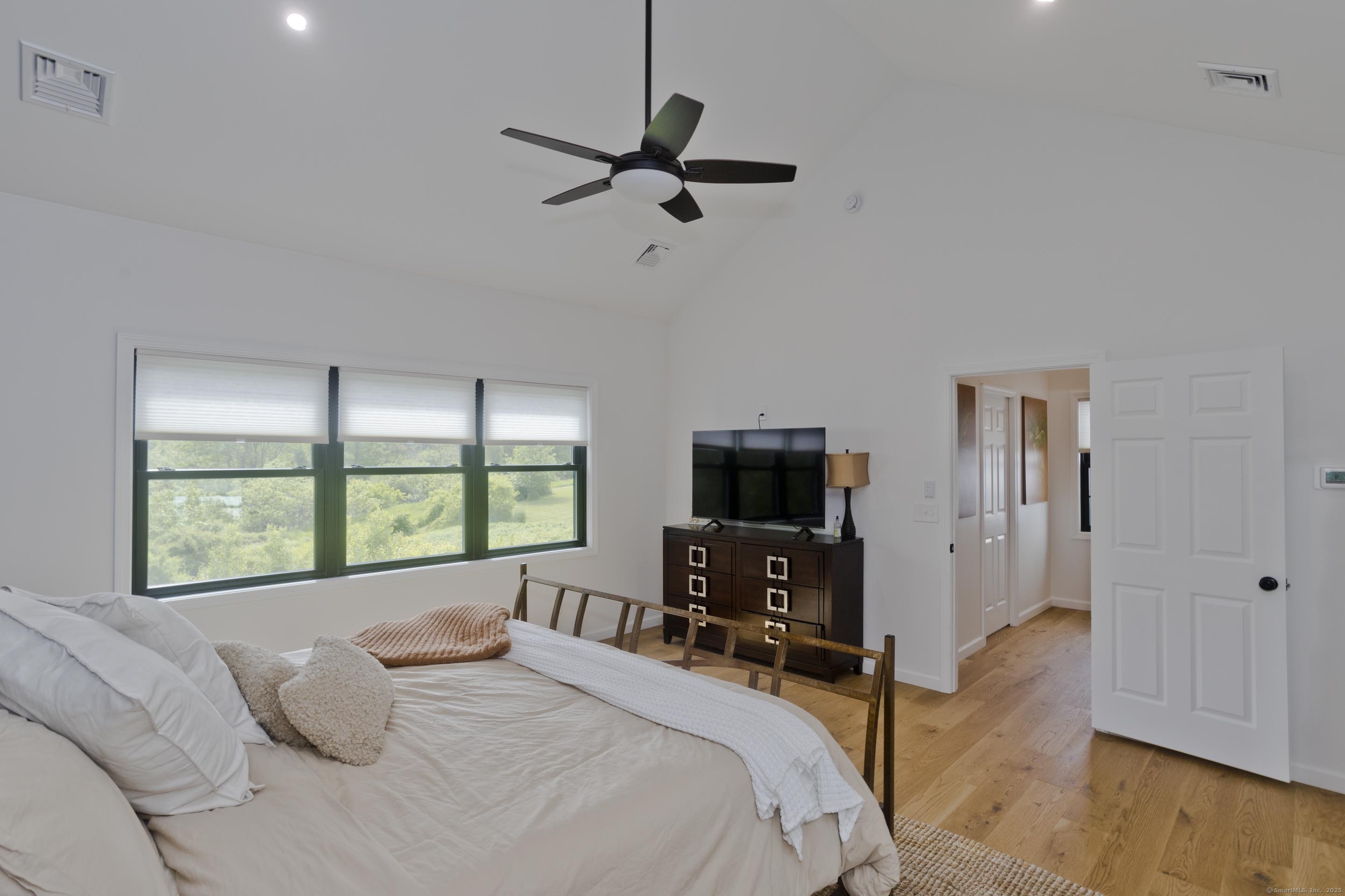 56 Margaret Street Monson, MA 01057 - Photo 21 of 39 a bedroom with a bed and a flat screen tv