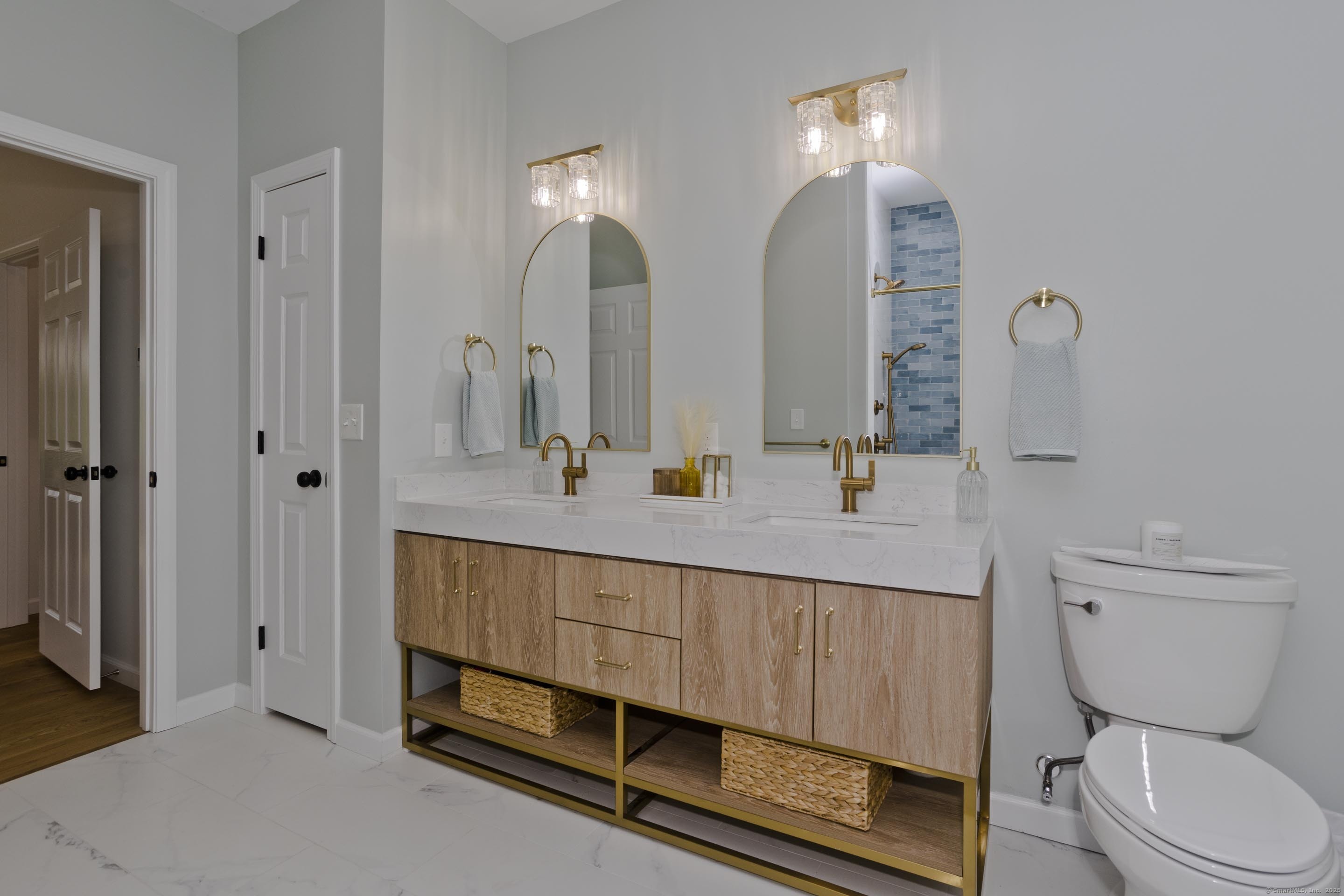 56 Margaret Street Monson, MA 01057 - Photo 22 of 39 a bathroom with a sink a toilet and a mirror