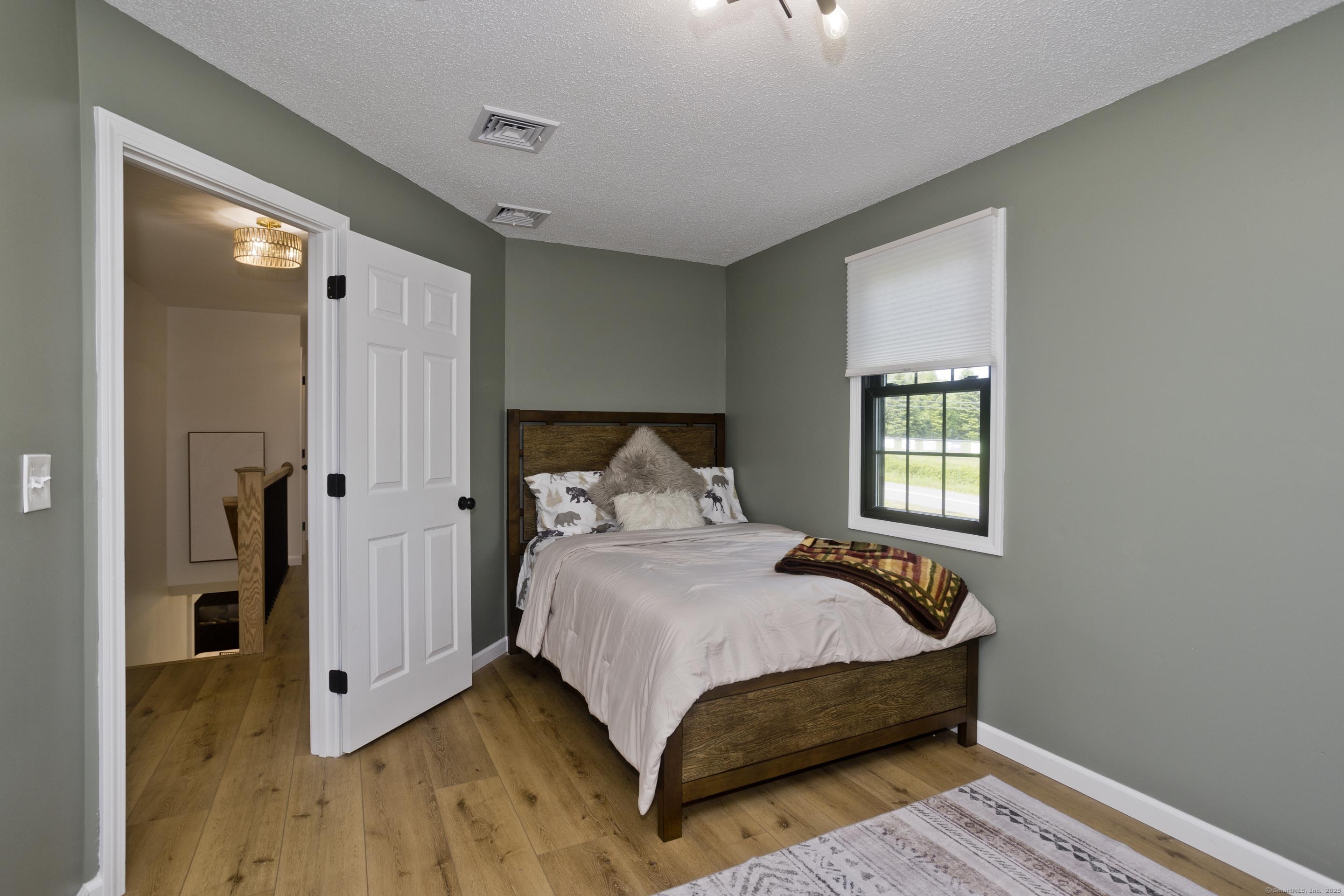 56 Margaret Street Monson, MA 01057 - Photo 26 of 39 a bedroom with a bed and a window