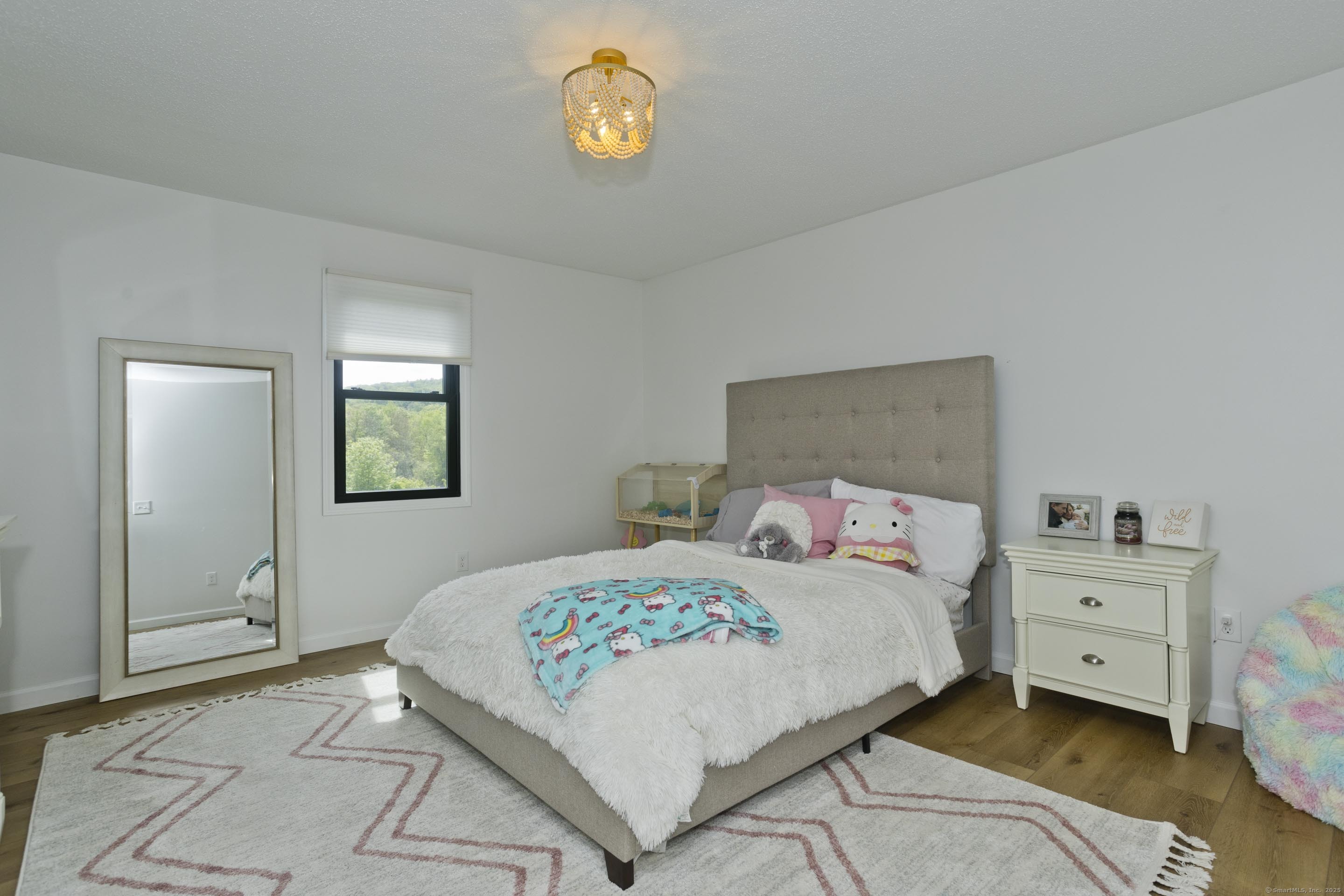 56 Margaret Street Monson, MA 01057 - Photo 29 of 39 a bedroom with a bed and a cabinets