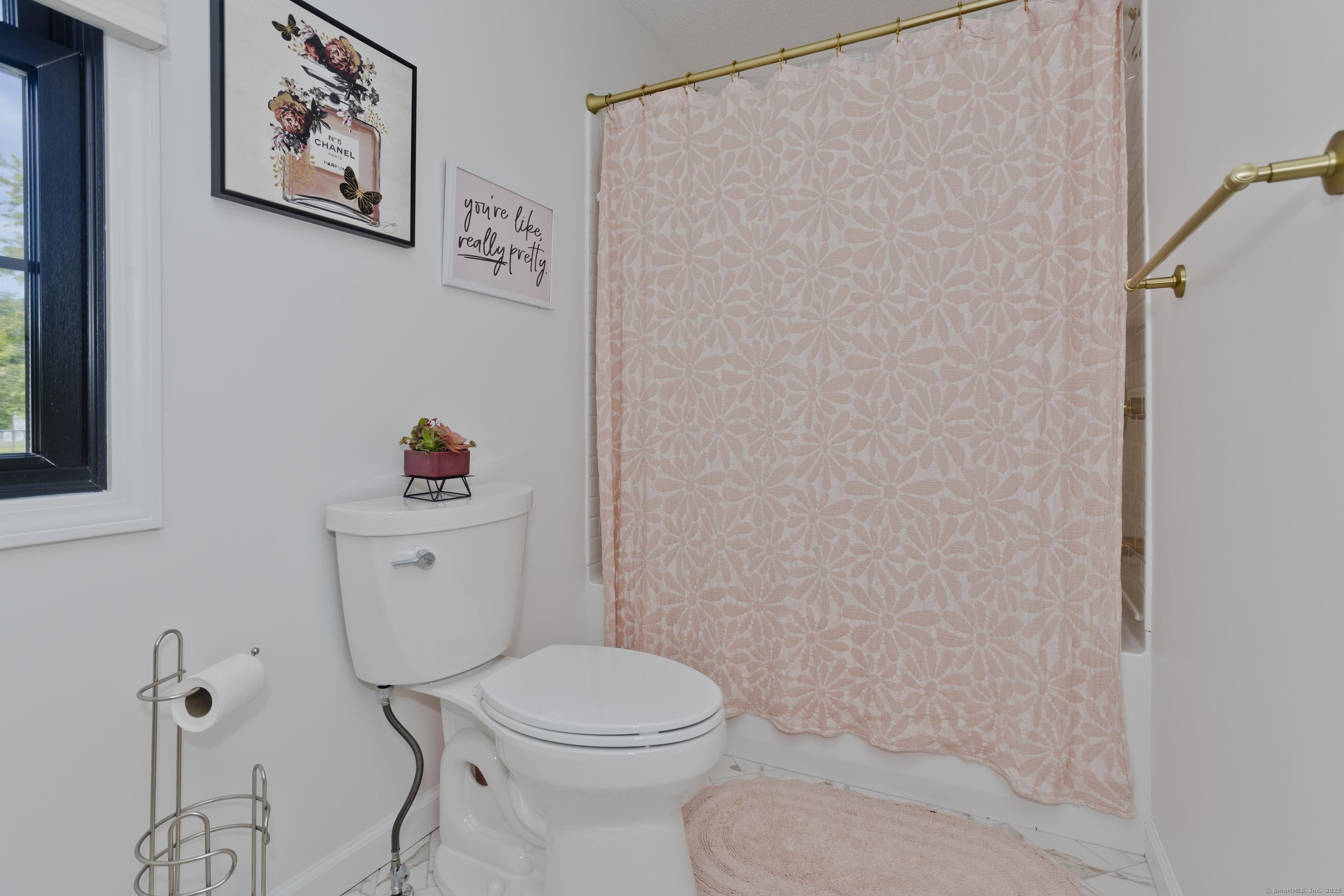 56 Margaret Street Monson, MA 01057 - Photo 32 of 39 a white toilet sitting next to a bathroom sink