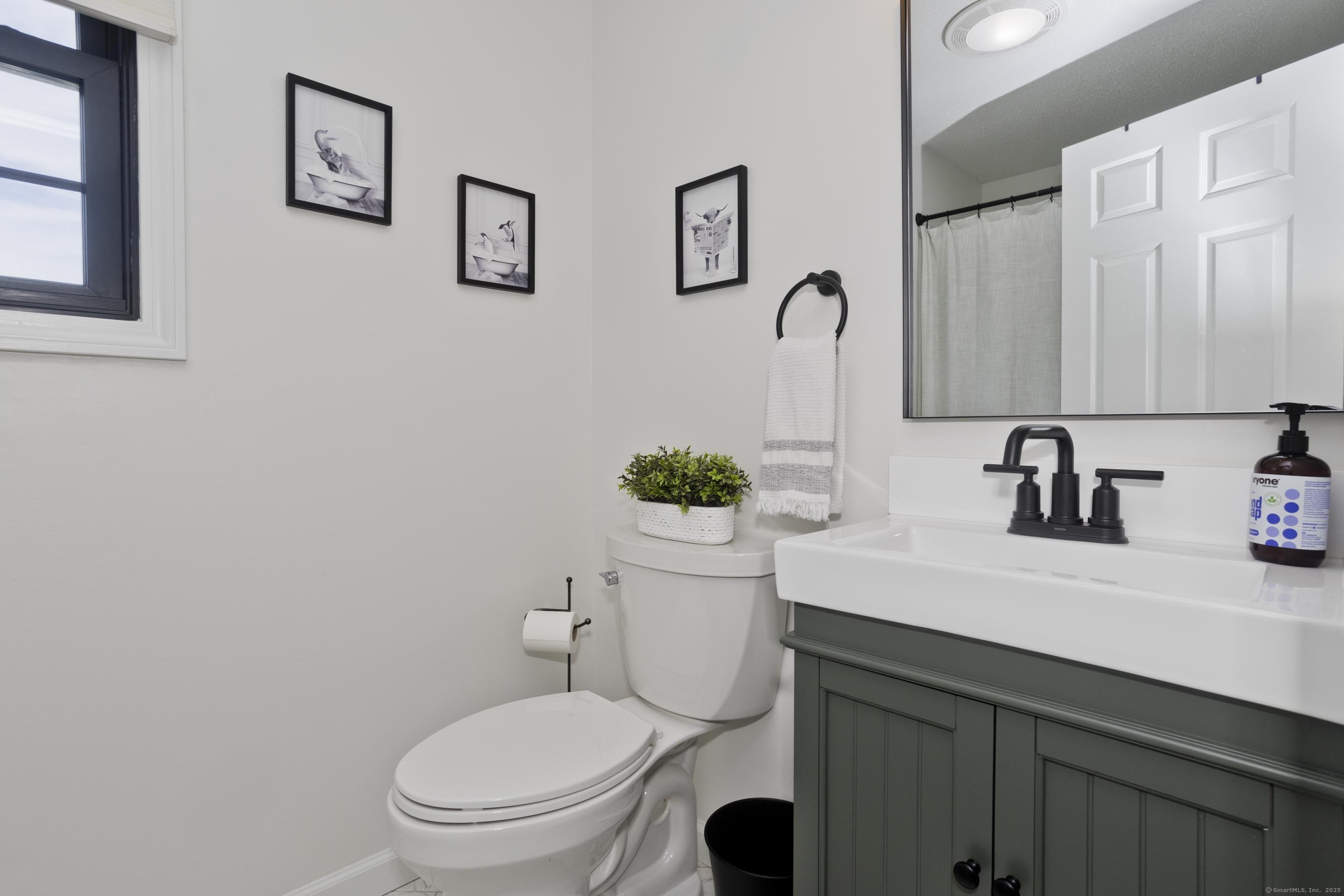 56 Margaret Street Monson, MA 01057 - Photo 34 of 39 a bathroom with a toilet sink and mirror