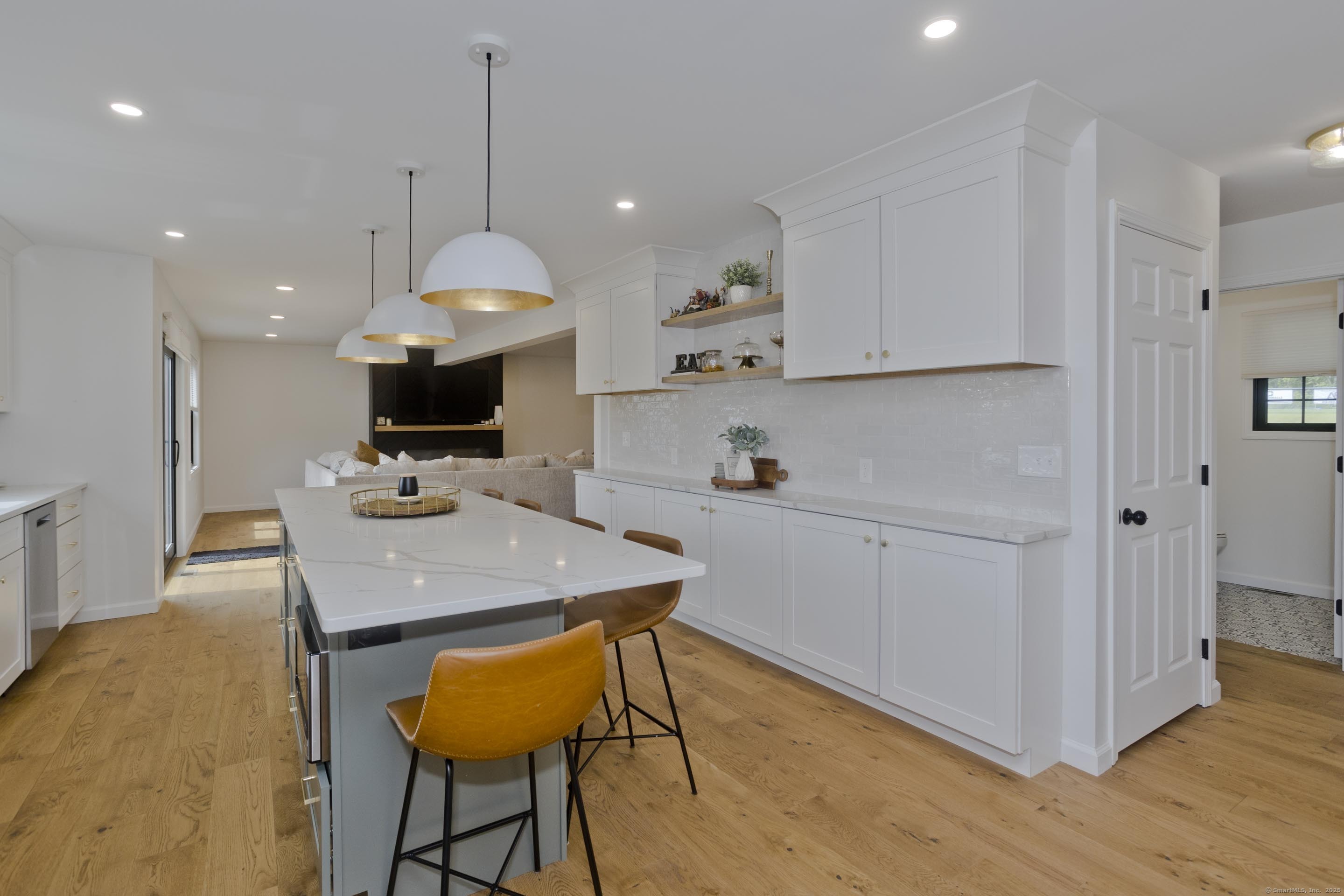 56 Margaret Street Monson, MA 01057 - Photo 8 of 39 a kitchen with a table chairs refrigerator and microwave