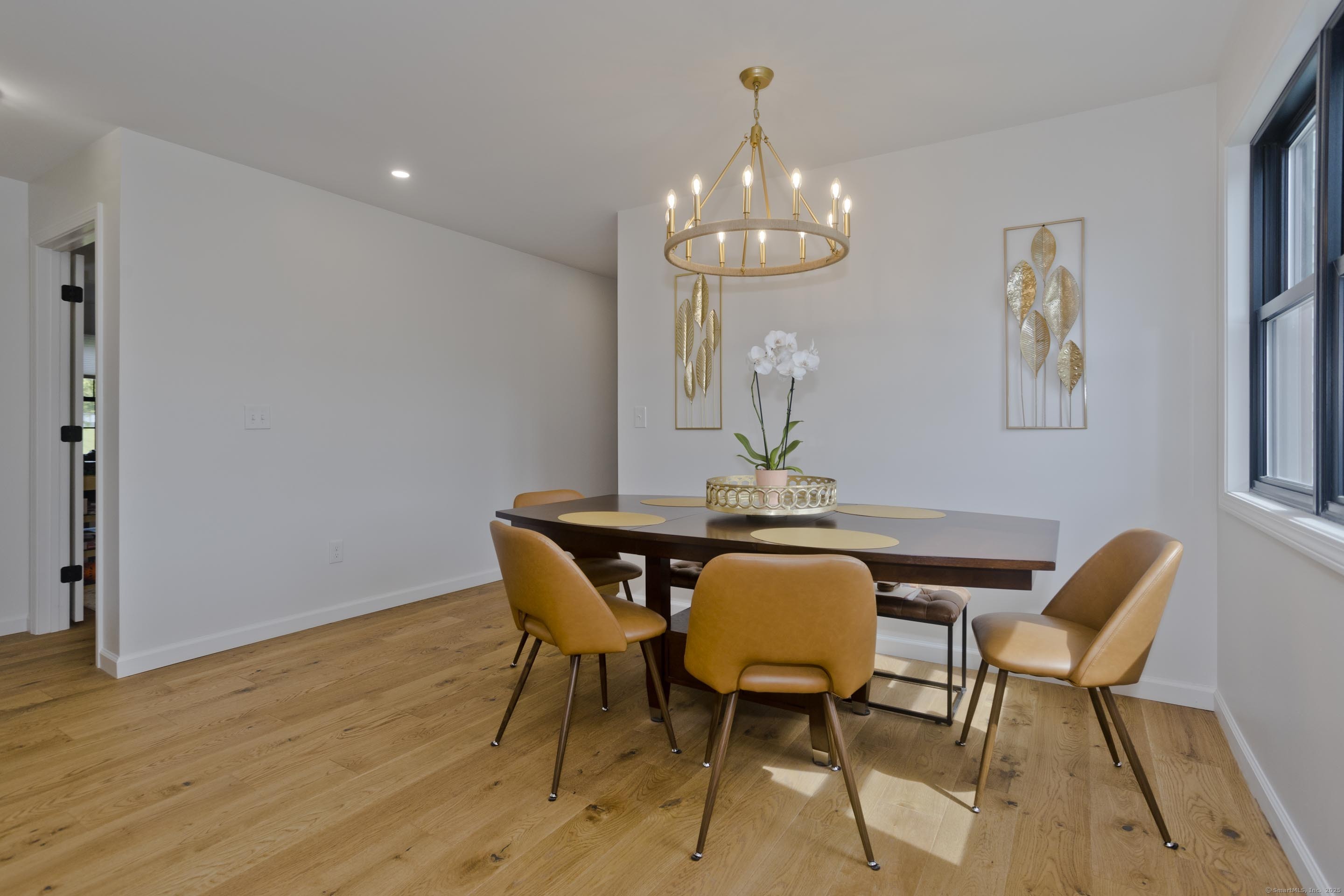 56 Margaret Street Monson, MA 01057 - Photo 9 of 39 a view of a dining room with furniture and chandelier