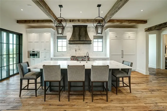a view of livingroom with kitchen and an entryway