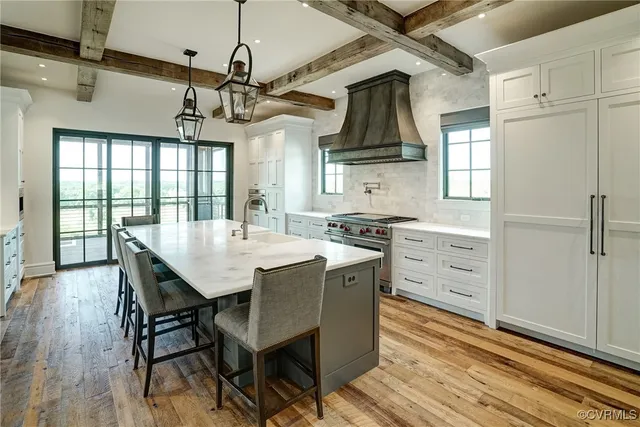 a spacious bathroom with a double vanity sink and mirror