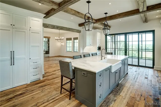a white bath tub sitting in a bathroom next to a window