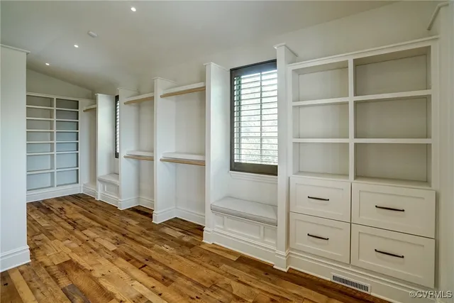 a living room with a fireplace and a flat screen tv