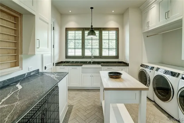 a view of an empty room with furniture and a window