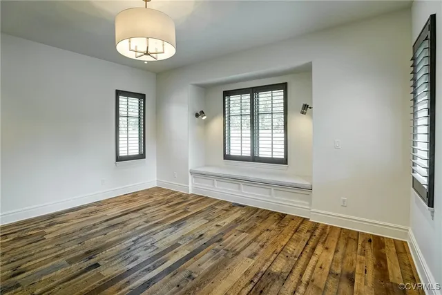 a view of a patio with a table and chairs and potted plants