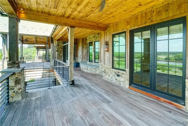 a aerial view of a house with a big yard and large trees