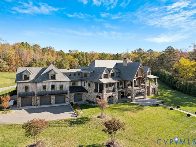 an empty room with wooden floor and a fireplace