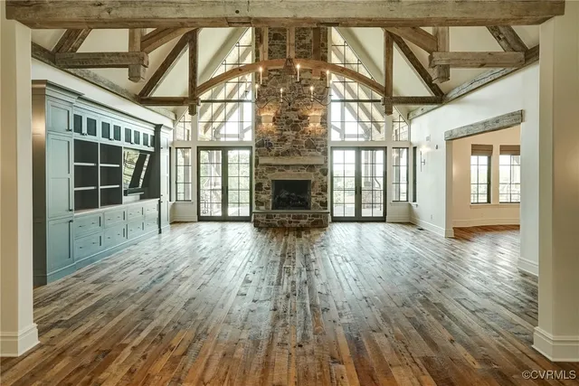 a bathroom with a granite countertop sink and a large window