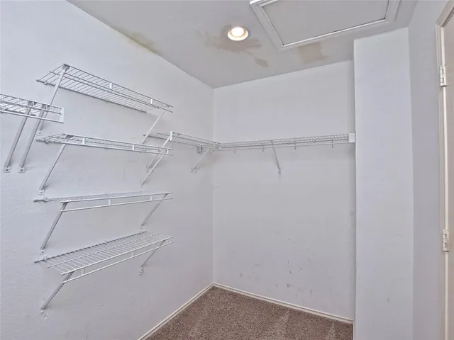 a view of an empty walk in closet