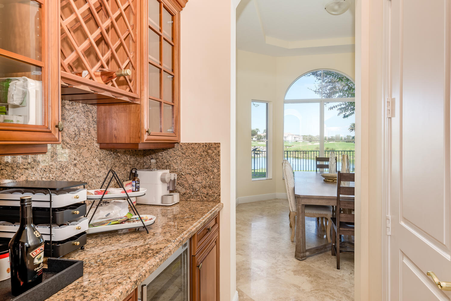 8849 Valhalla Drive Delray Beach, FL 33446 - Photo 13 of 32 a view of a kitchen with furniture and a window