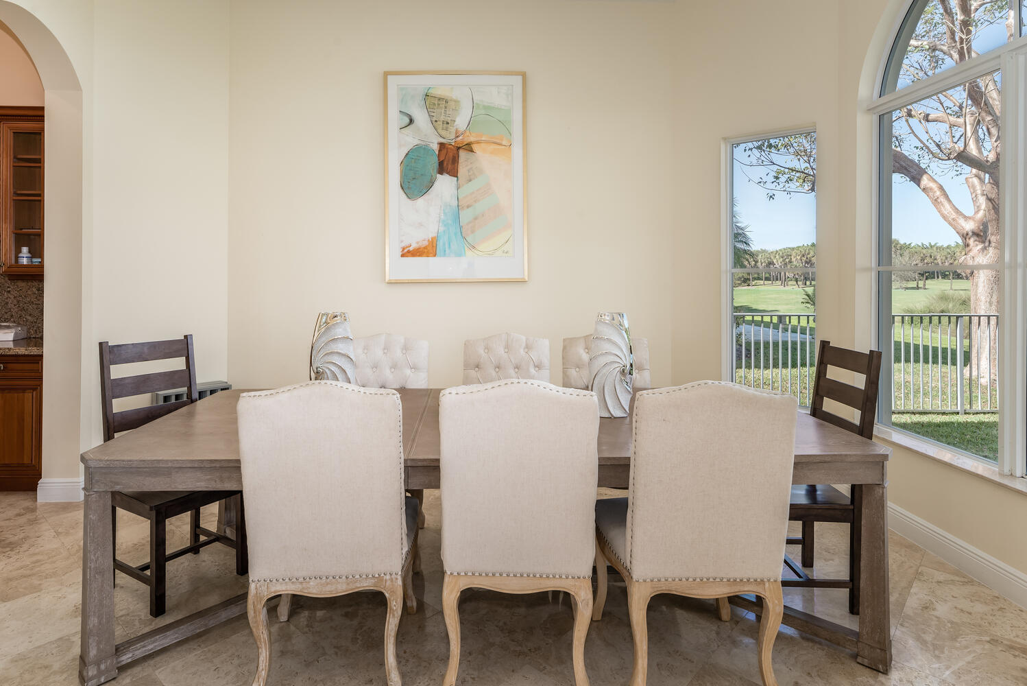8849 Valhalla Drive Delray Beach, FL 33446 - Photo 14 of 32 a view of a dining room with furniture large window and wooden floor