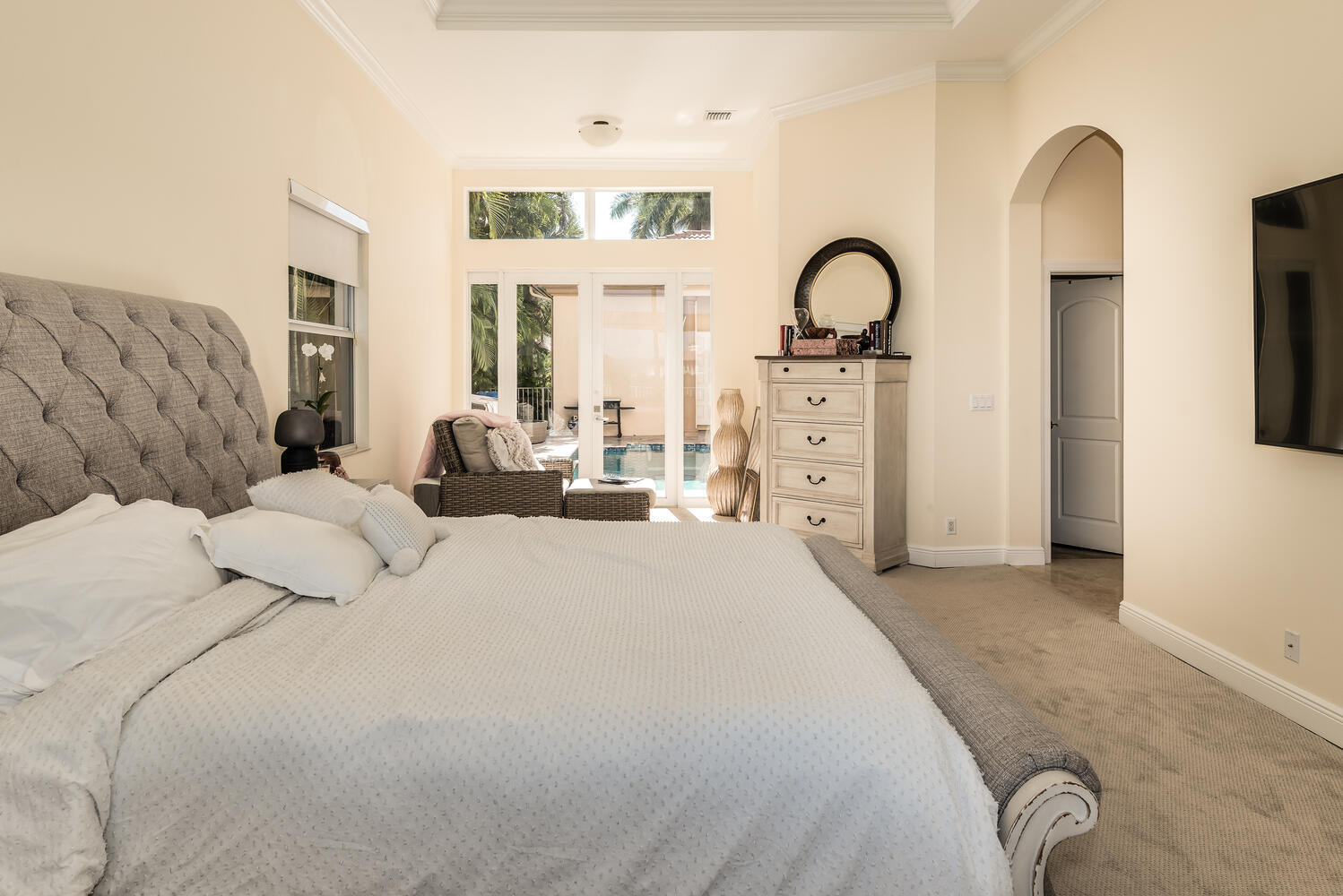 8849 Valhalla Drive Delray Beach, FL 33446 - Photo 17 of 32 a bedroom with bed and cabinets