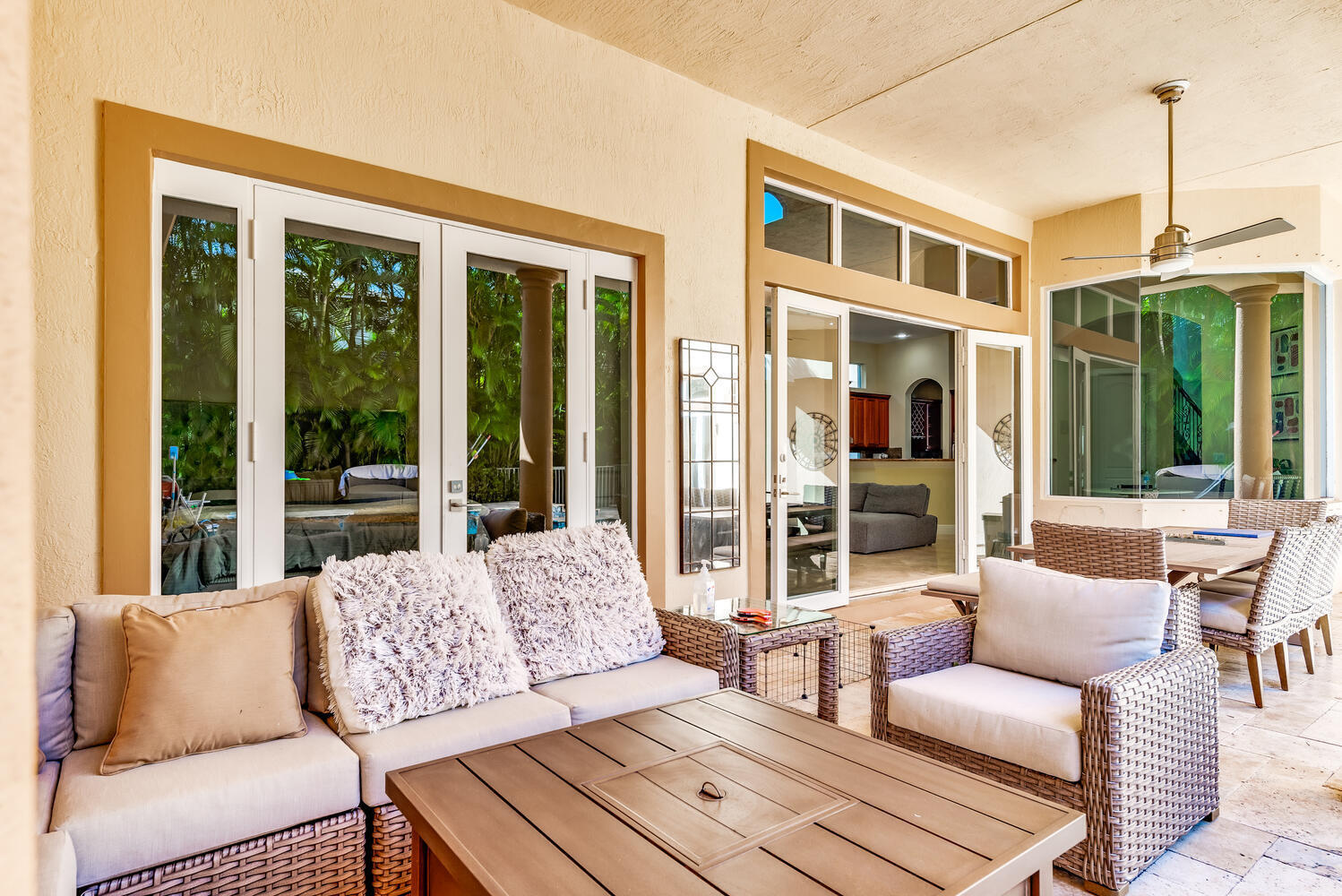 8849 Valhalla Drive Delray Beach, FL 33446 - Photo 31 of 32 a living room with furniture and floor to ceiling windows