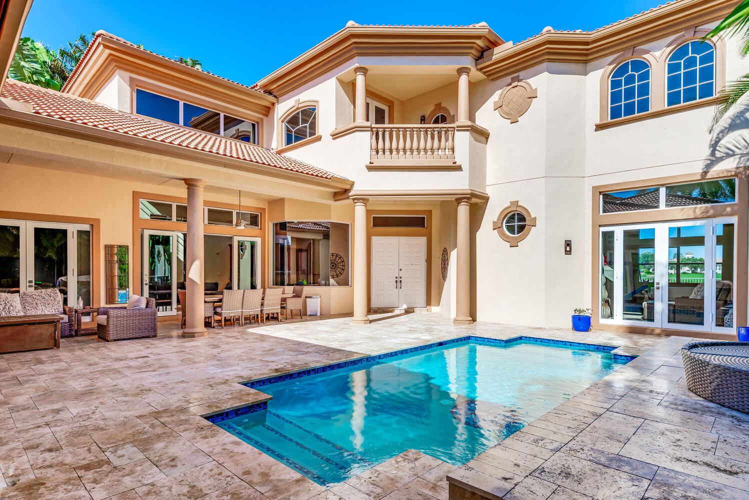 8849 Valhalla Drive Delray Beach, FL 33446 - Photo 32 of 32 a front view of a house with swimming pool and furniture