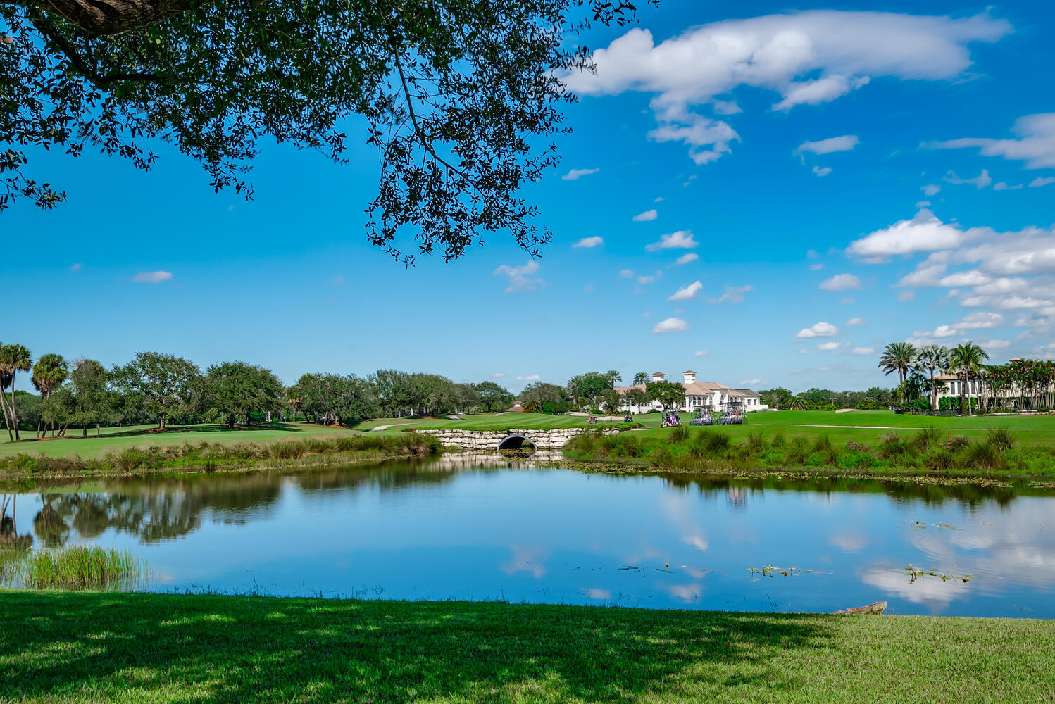 8849 Valhalla Drive Delray Beach, FL 33446 - Photo 4 of 32 a view of a lake with houses in the back