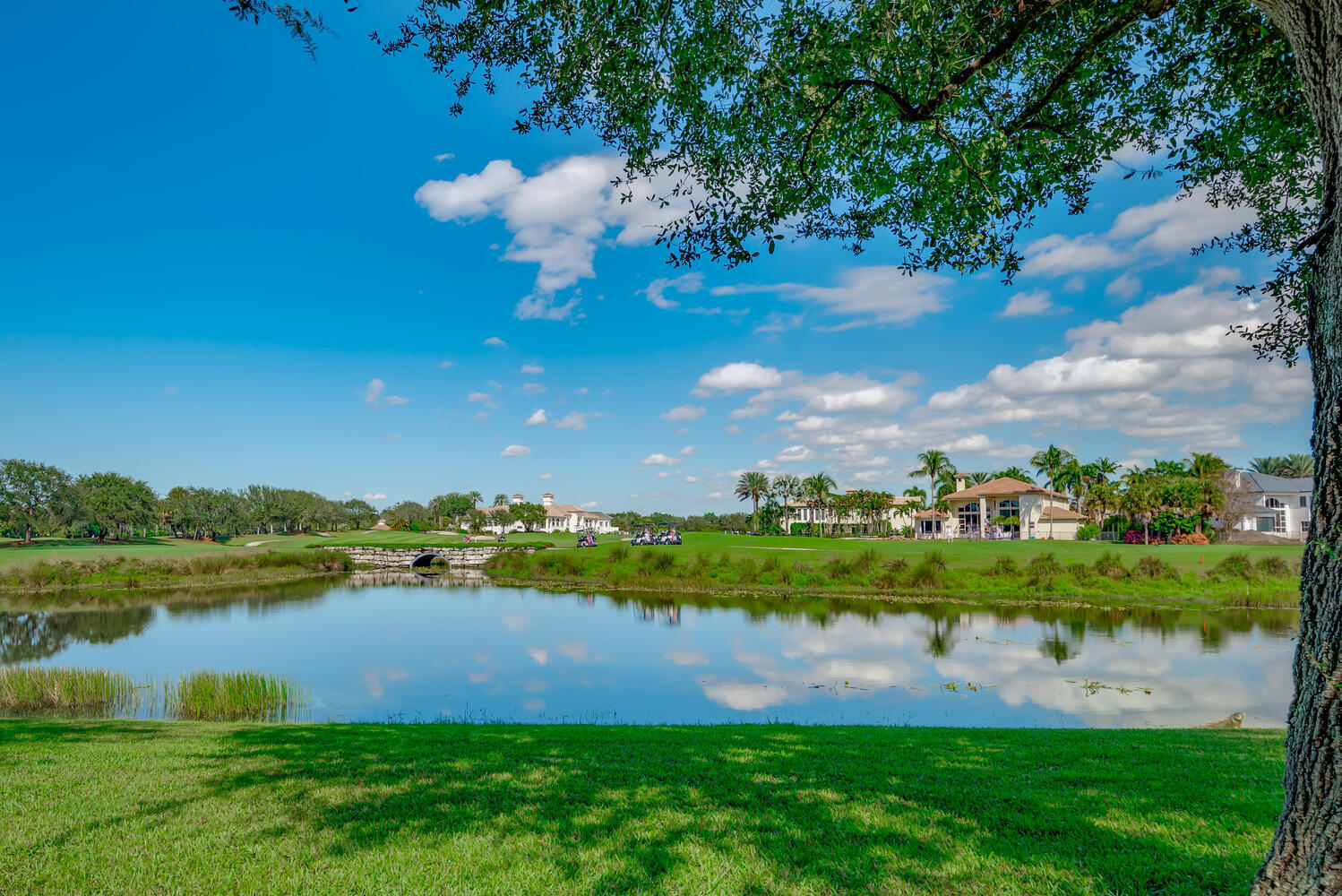 8849 Valhalla Drive Delray Beach, FL 33446 - Photo 7 of 32 a view of a lake with houses in the back