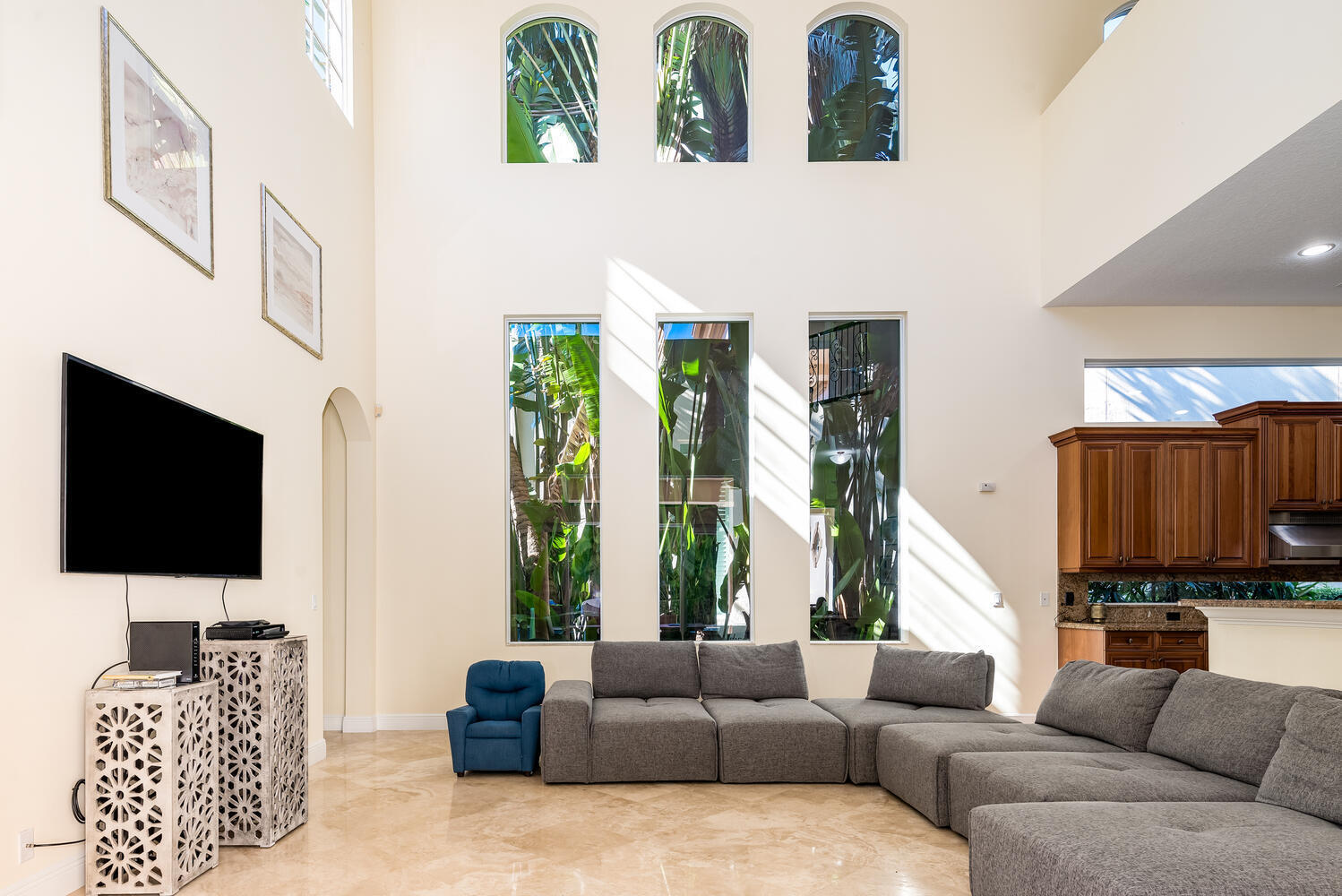 8849 Valhalla Drive Delray Beach, FL 33446 - Photo 10 of 32 a living room with furniture and a flat screen tv