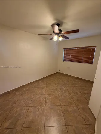 a bathroom with a sink and glass door
