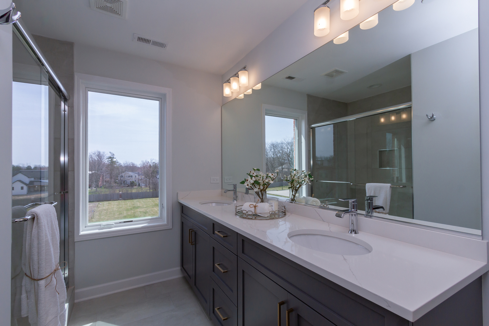 1209 Shermer Road Northbrook, IL 60062 - Photo 13 of 23 a bathroom with a sink double vanity and a mirror