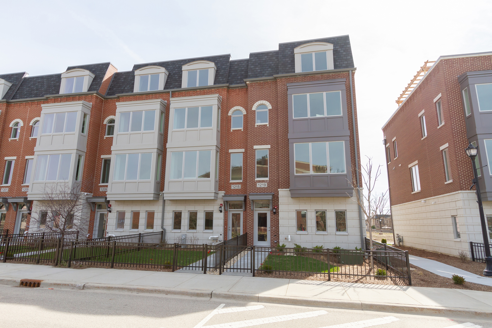 1209 Shermer Road Northbrook, IL 60062 - Photo 23 of 23 a front view of a residential apartment building with a yard
