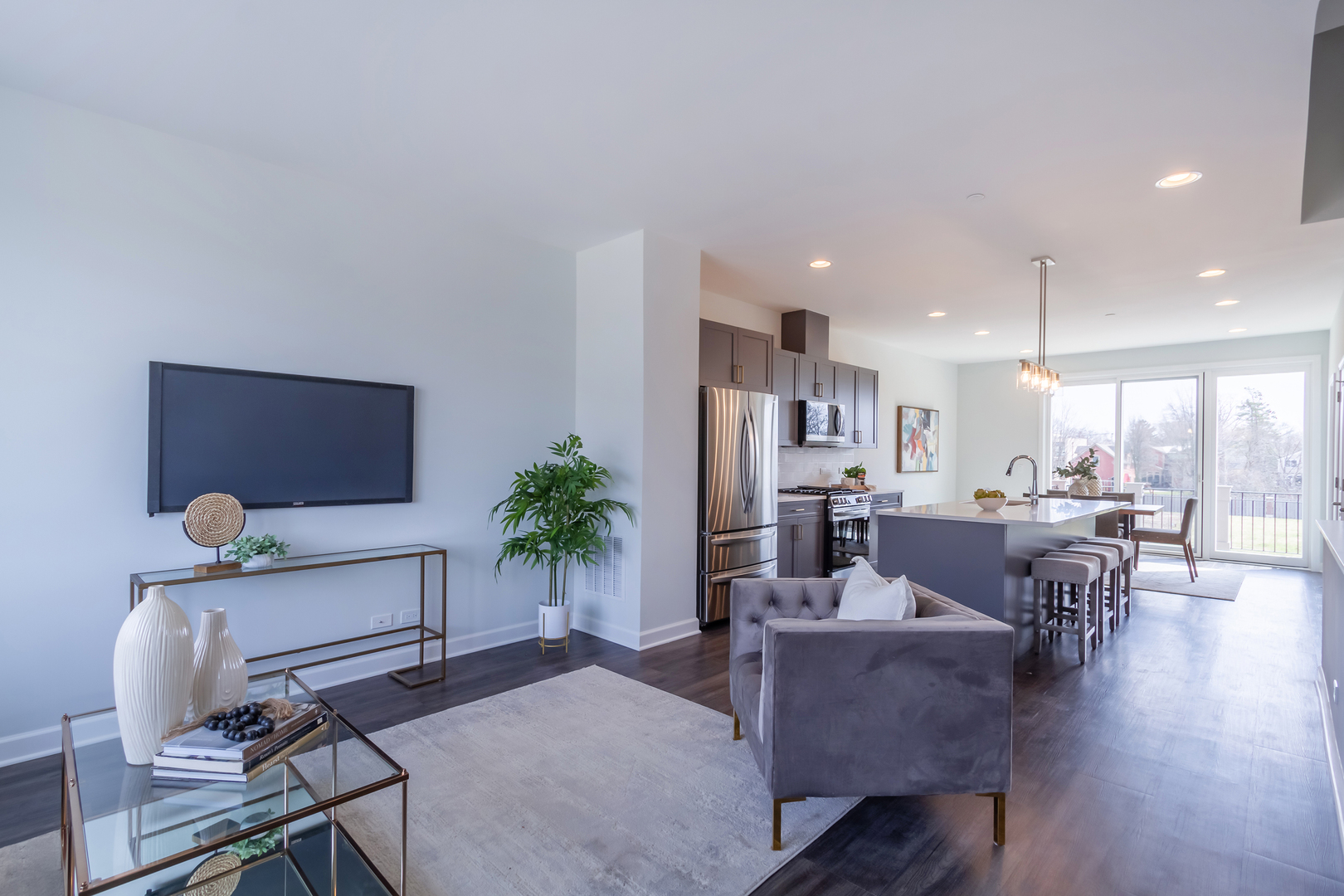 1209 Shermer Road Northbrook, IL 60062 - Photo 4 of 23 a living room with furniture kitchen view and a potted plant