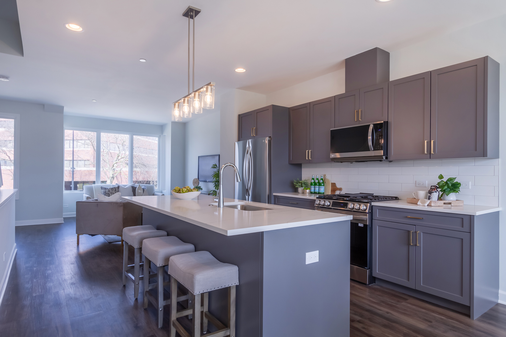 1209 Shermer Road Northbrook, IL 60062 - Photo 6 of 23 a kitchen with sink a microwave and cabinets