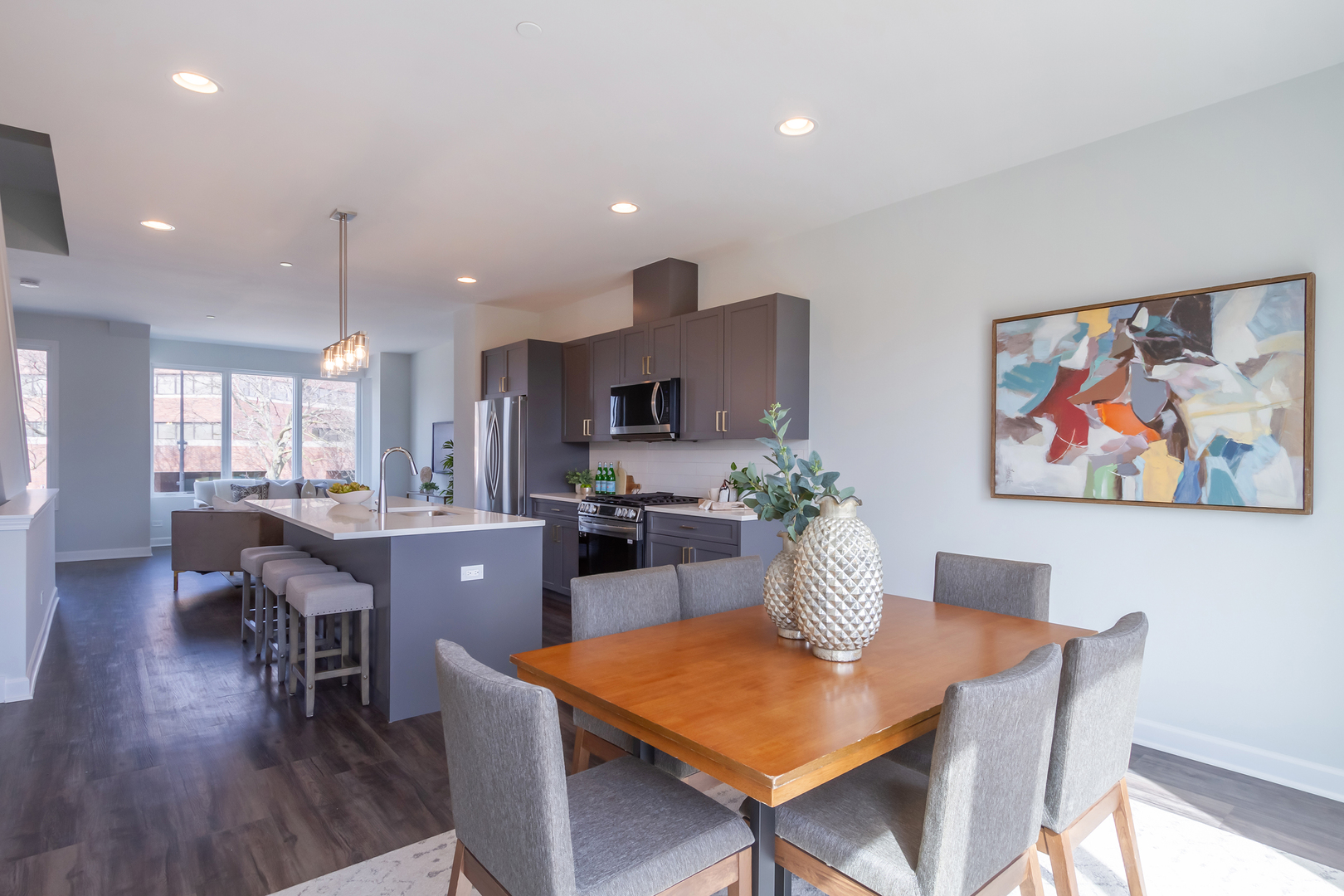 1209 Shermer Road Northbrook, IL 60062 - Photo 8 of 23 a living room with furniture kitchen view and a wooden floor