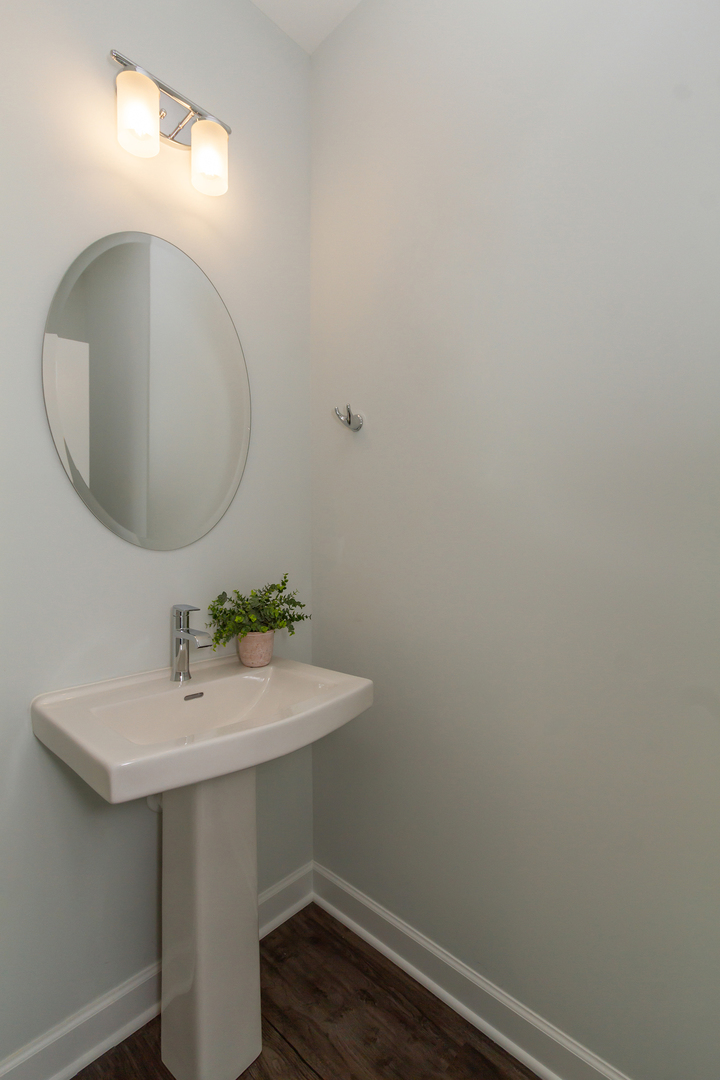 1209 Shermer Road Northbrook, IL 60062 - Photo 10 of 23 a bathroom with a sink mirror and vanity