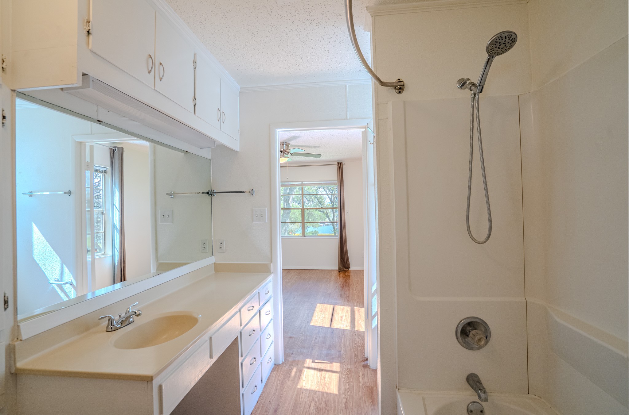 16013 Edwards Drive Austin, TX 78734 - Photo 15 of 18 Ample counter space and integrated storage create a well-appointed bathroom.