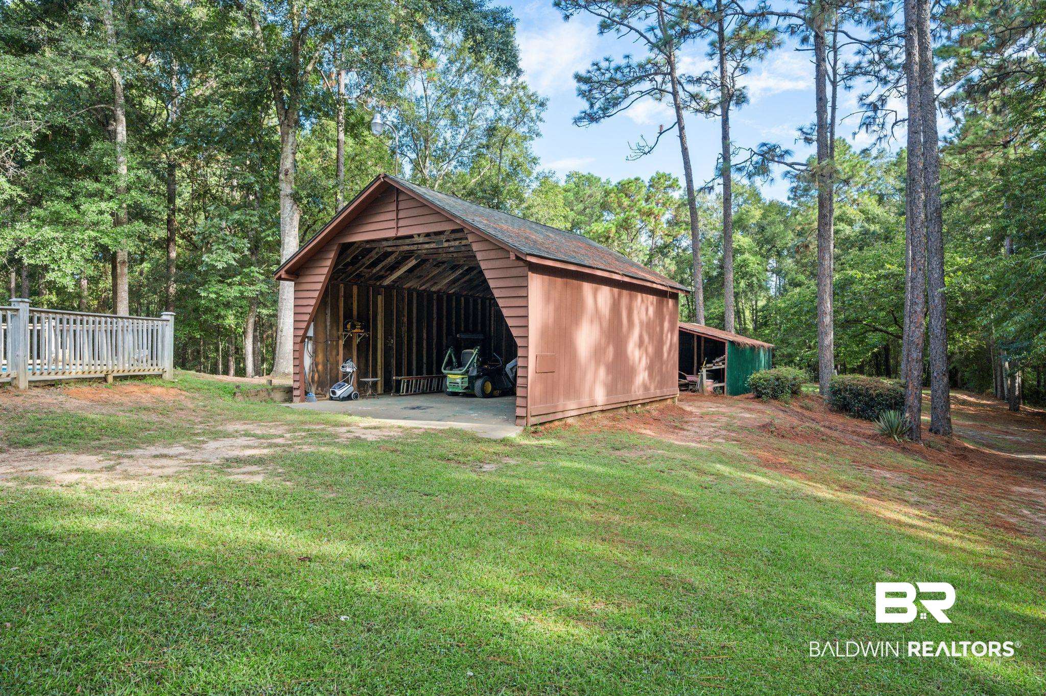 4566 McCrary Road, Unit A Semmes, AL 36575 - Photo 4 of 28 View of outdoor structure with a yard