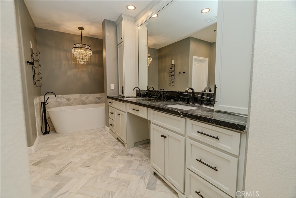 14 San Sovino Newport Coast, CA 92657 - Photo 12 of 44 a spacious bathroom with a sink and a mirror