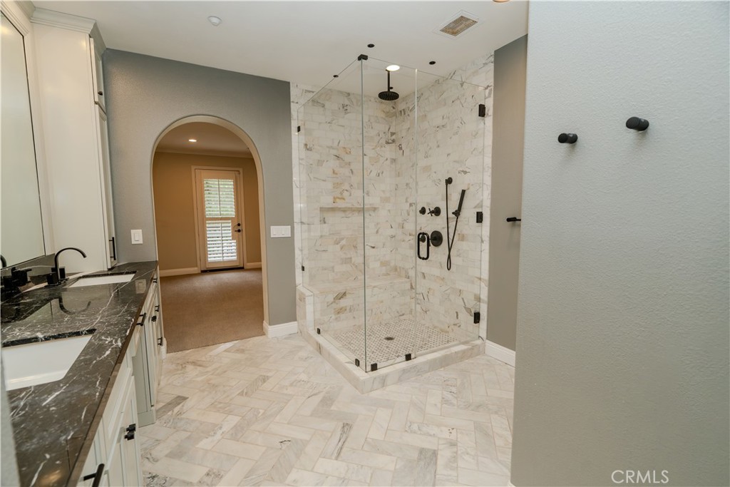 14 San Sovino Newport Coast, CA 92657 - Photo 14 of 44 a bathroom with a sink a toilet and shower