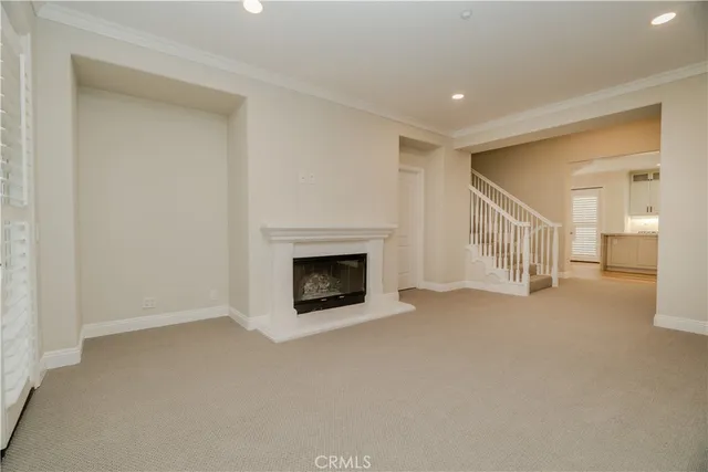 a view of an empty room with a fireplace
