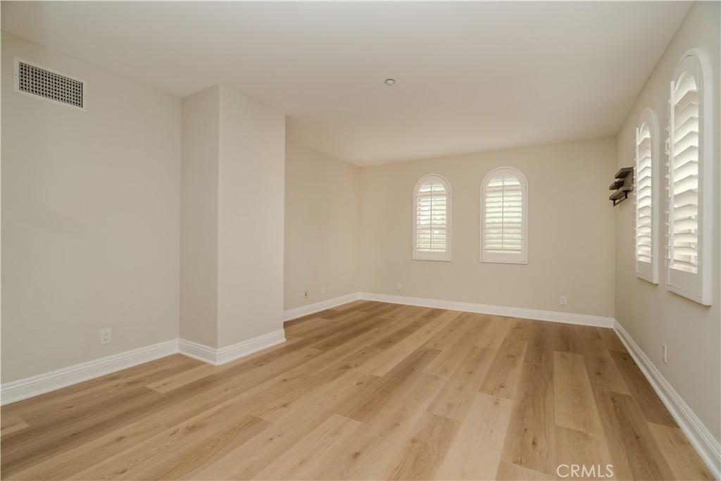 14 San Sovino Newport Coast, CA 92657 - Photo 31 of 44 a view of an empty room with wooden floor and window