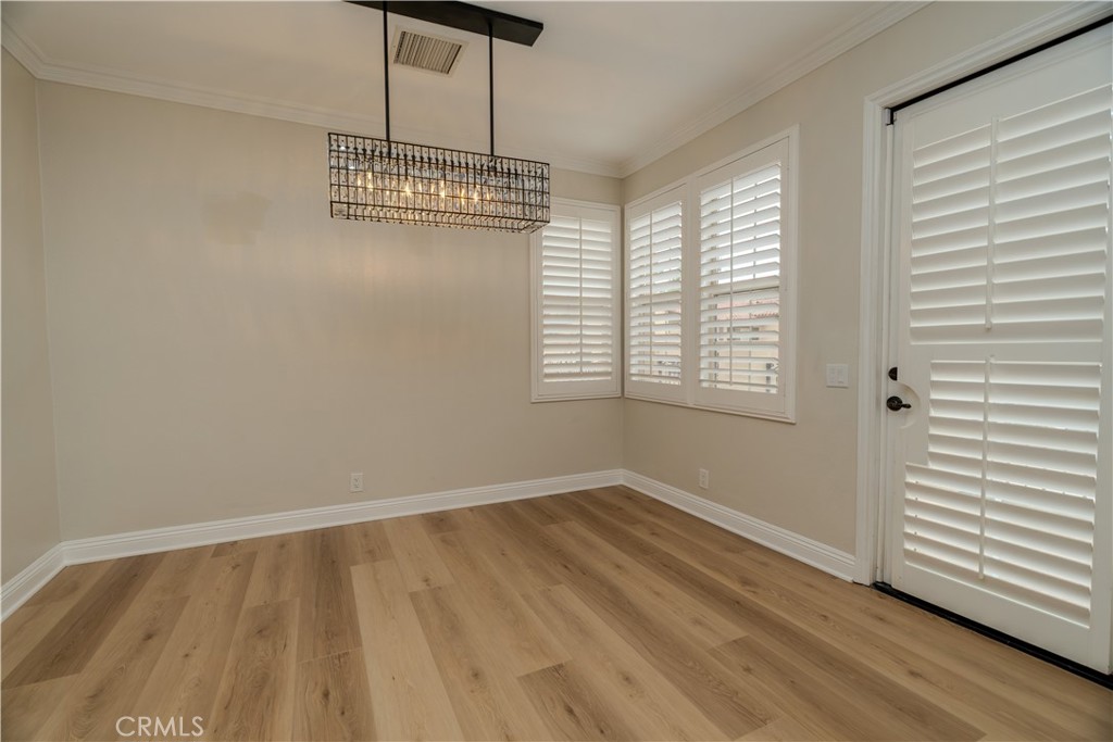 14 San Sovino Newport Coast, CA 92657 - Photo 5 of 44 a view of an empty room with wooden floor and a window