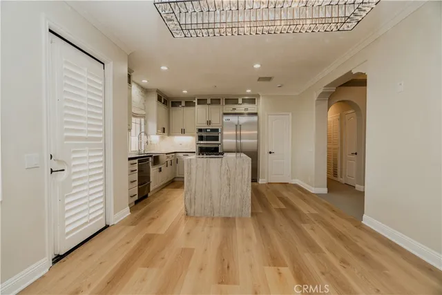 a view of a kitchen with electric appliances