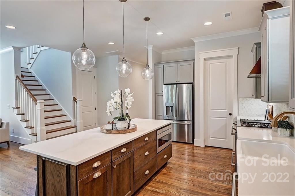 911 Millbrook Road Charlotte, NC 28211 - Photo 15 of 43 a bathroom with a sink a large mirror and a shower