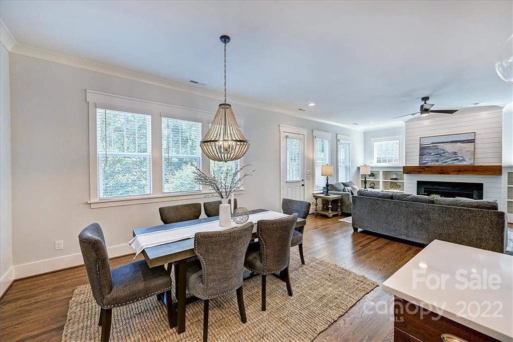 911 Millbrook Road Charlotte, NC 28211 - Photo 16 of 43 a view of a dining room with furniture window and wooden floor