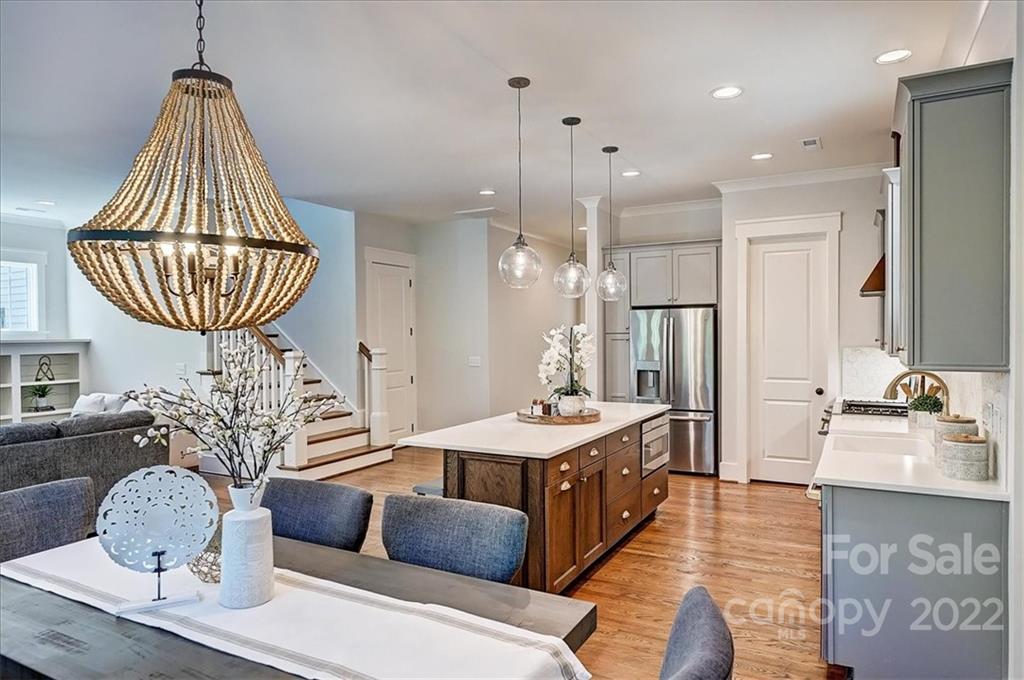 911 Millbrook Road Charlotte, NC 28211 - Photo 18 of 43 a living room with furniture a chandelier and a chandelier