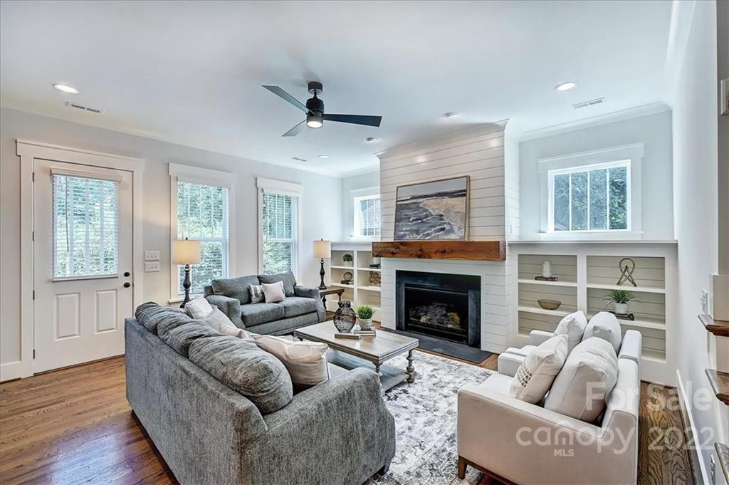911 Millbrook Road Charlotte, NC 28211 - Photo 19 of 43 a living room with furniture and a fireplace